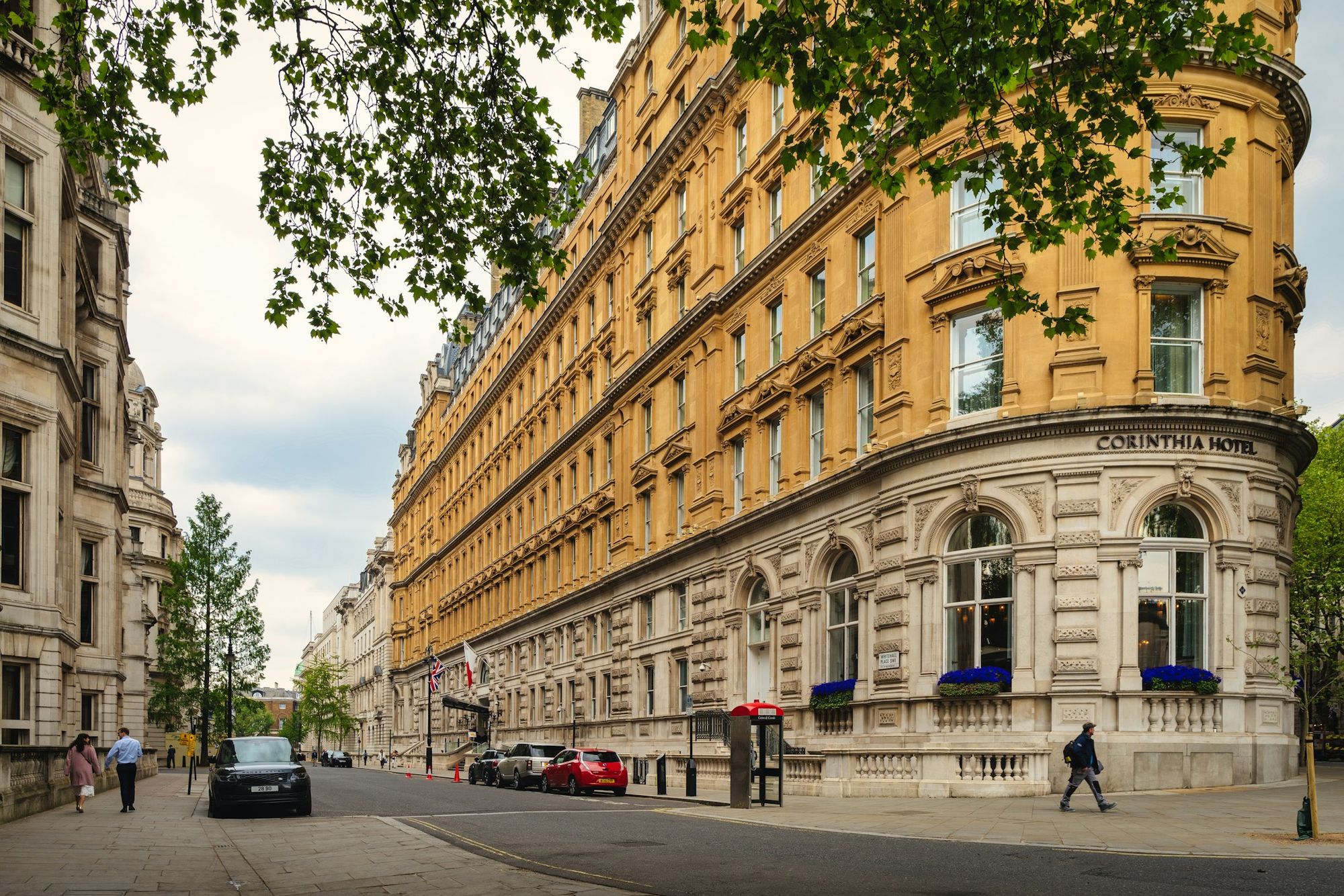 A Knightsbridge street of tall stucco buildings and trees