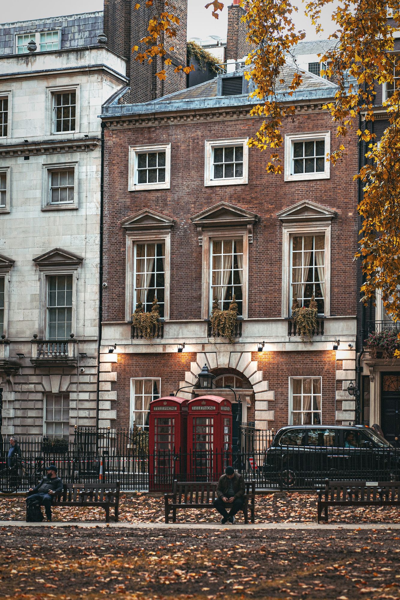 A Georgian brick house in Mayfair with lanterns at the door