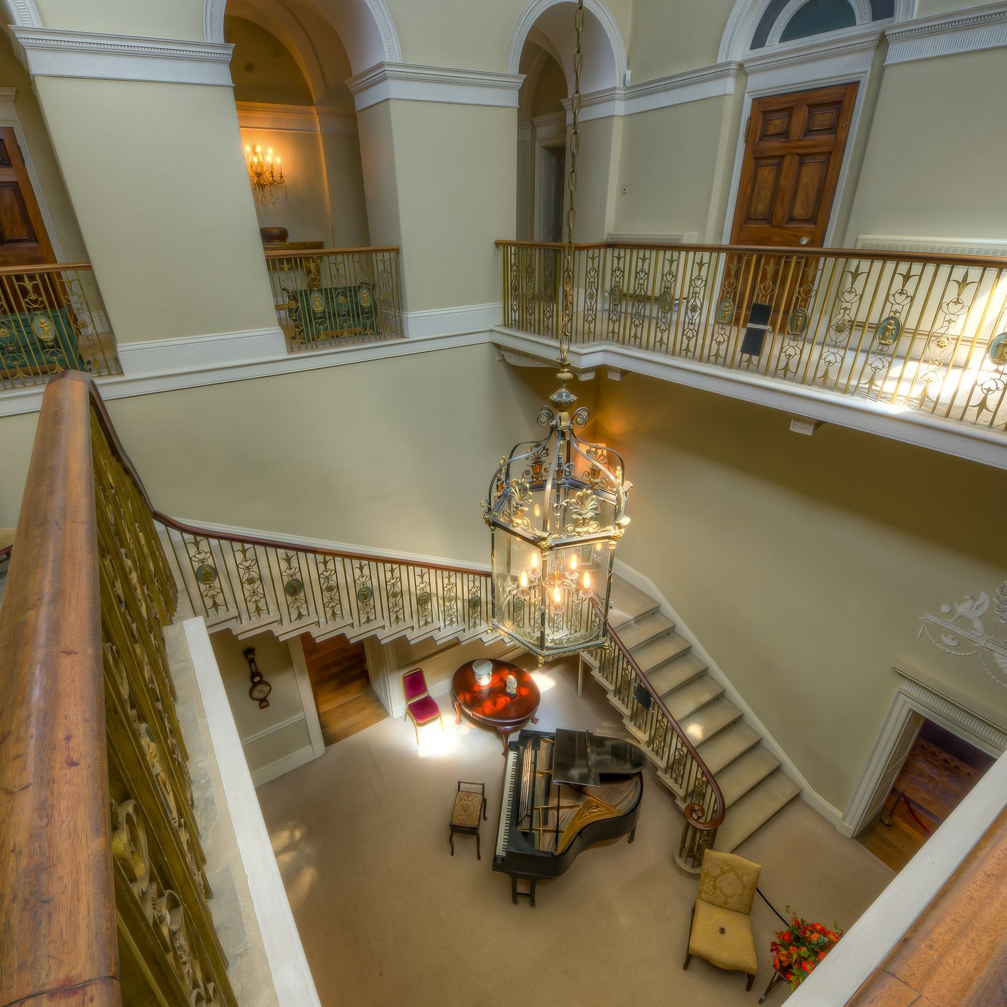 A stair hall seen from above with a chandelier